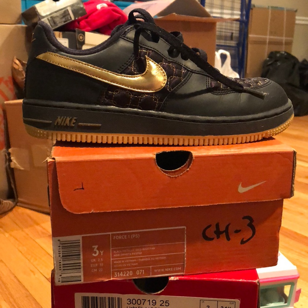 Black and gold Nike